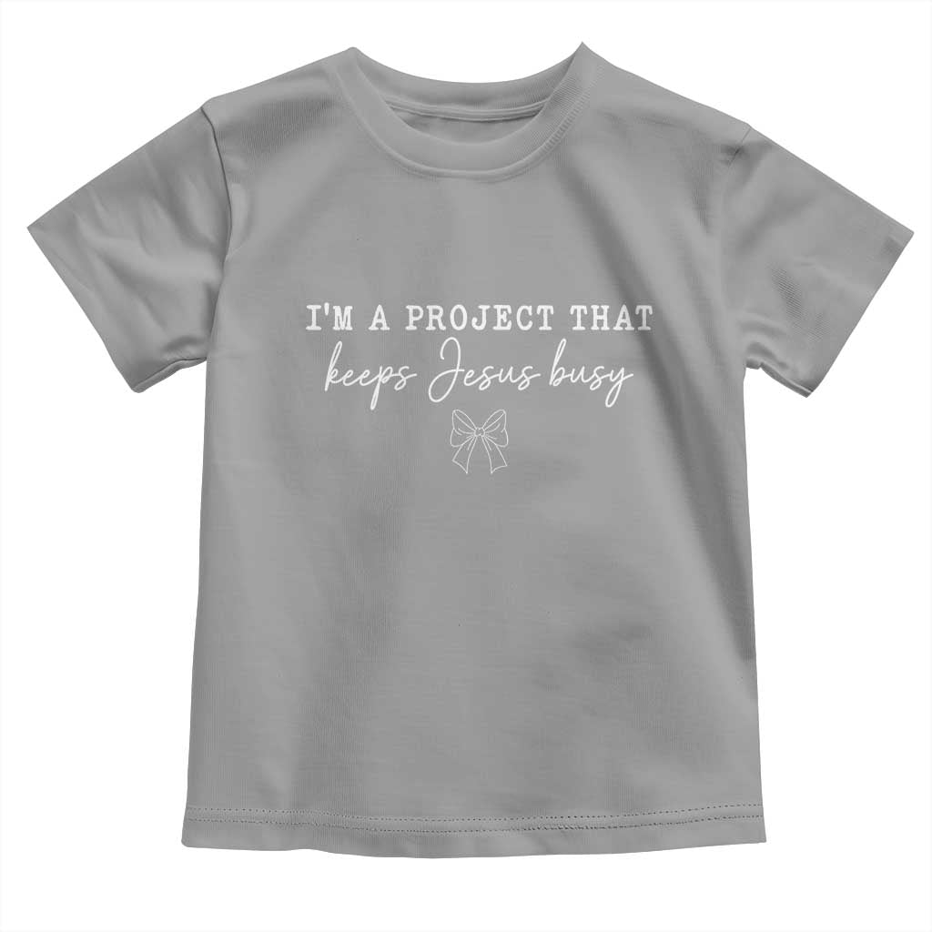 I’m a Project That Keeps Jesus Busy Coquette Bow Toddler T Shirt Christian Faith Humor