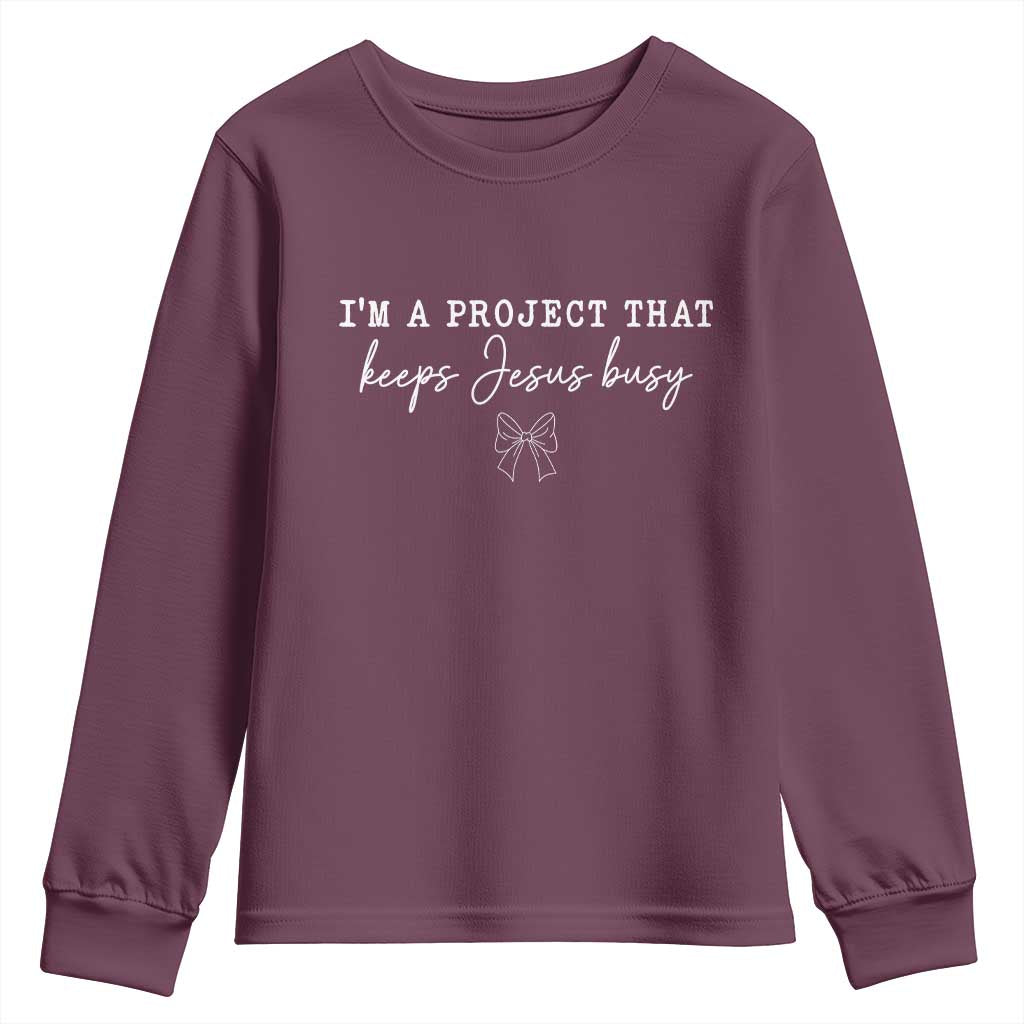 I’m a Project That Keeps Jesus Busy Coquette Bow Youth Sweatshirt Christian Faith Humor