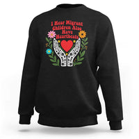 I Hear Migrant Children Also Have Heartbeats Sweatshirt Groovy Retro Floral Hands Heart Social Justice