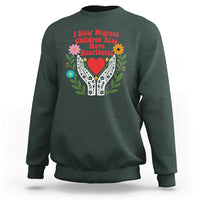 I Hear Migrant Children Also Have Heartbeats Sweatshirt Groovy Retro Floral Hands Heart Social Justice
