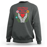 I Hear Migrant Children Also Have Heartbeats Sweatshirt Groovy Retro Floral Hands Heart Social Justice