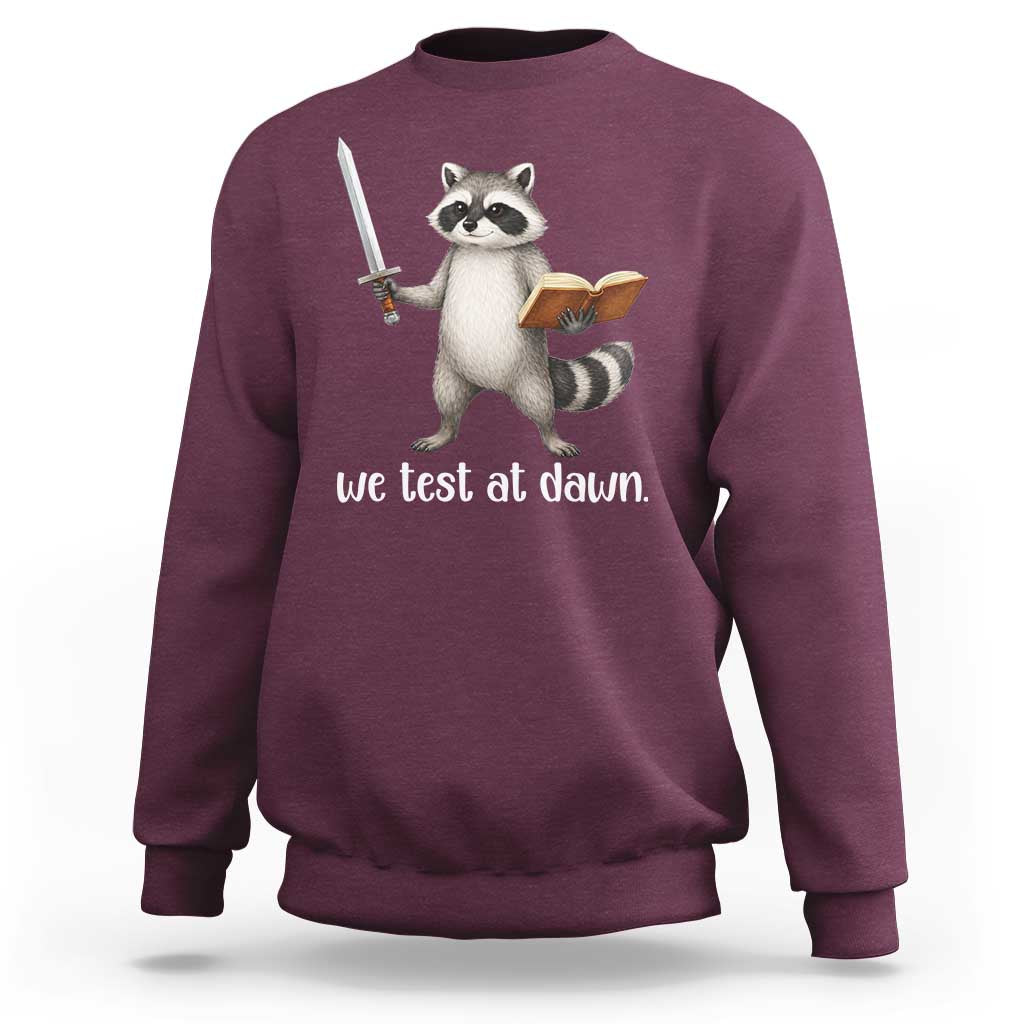 We Test At Dawn Raccoon Warrior Sweatshirt Funny Student Teacher Exam Motivation