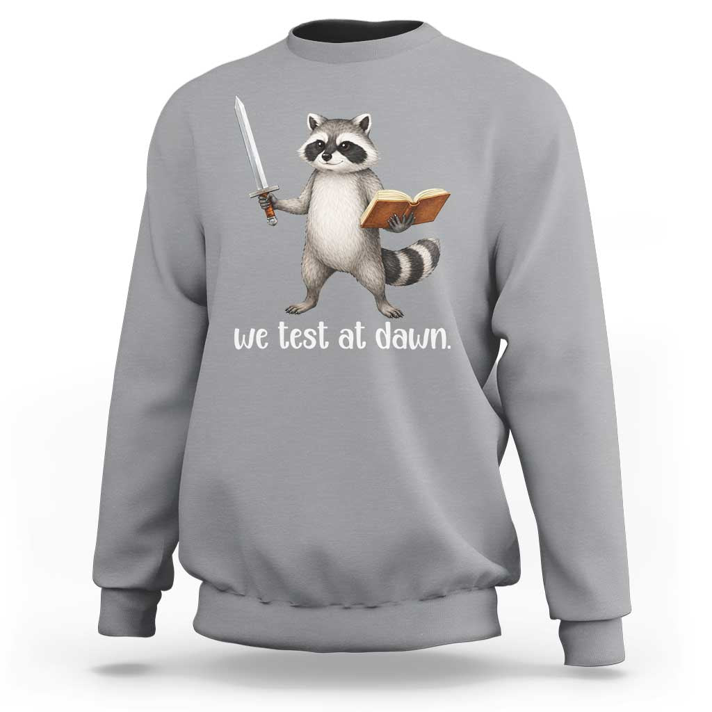 We Test At Dawn Raccoon Warrior Sweatshirt Funny Student Teacher Exam Motivation