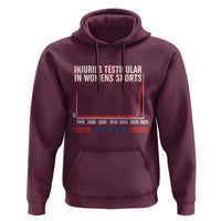 Testicular Injuries in Womens Sports Satirical Graphic Hoodie Dark Humor with Controversial Commentary - Wonder Print Shop
