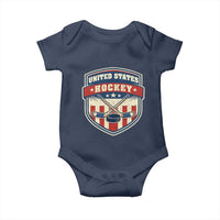 Hockey Crossed Sticks And Puck Retro USA Shield Flag Baby Onesie Red White Blue Striped Patriotic Sports Fan Pride Graphic