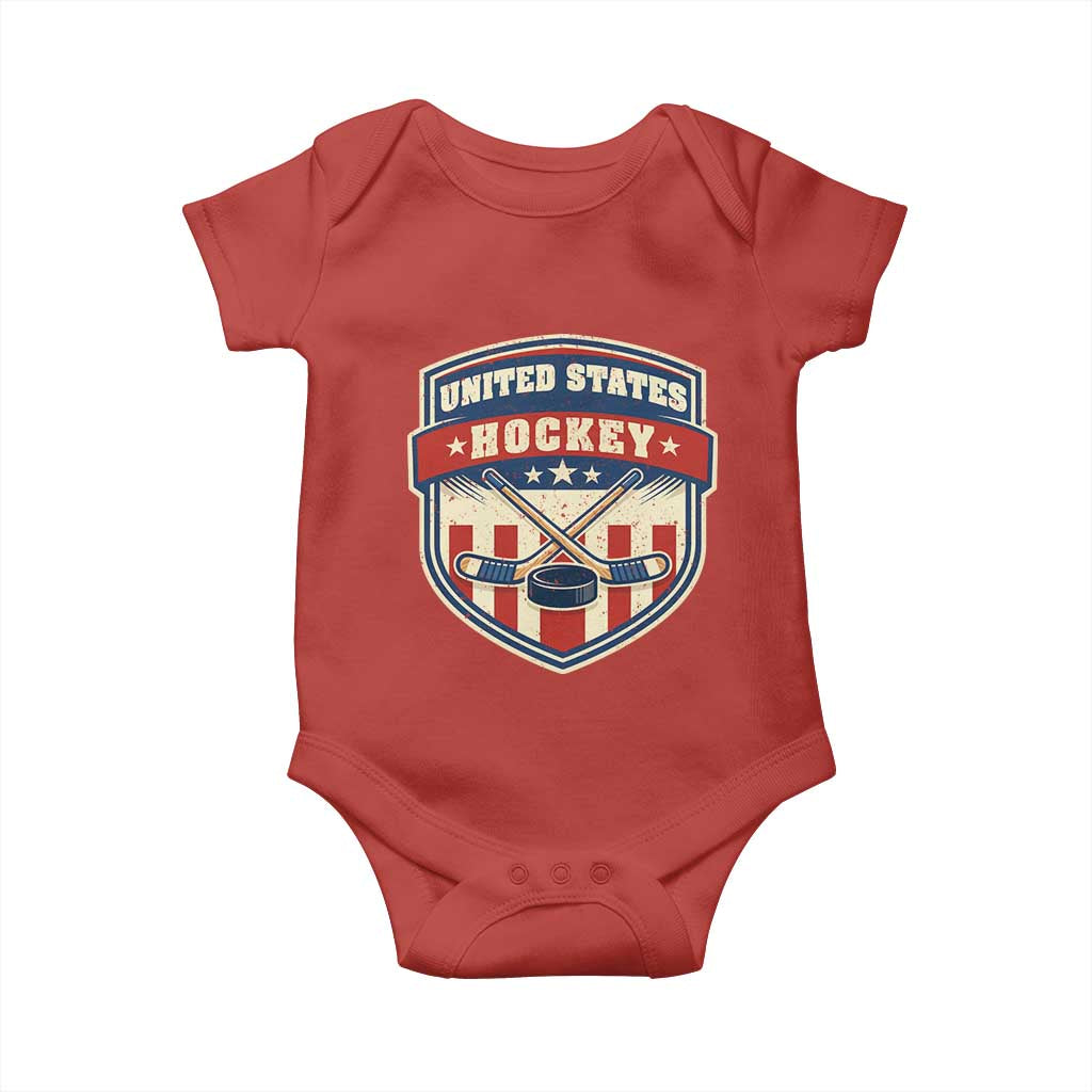 Hockey Crossed Sticks And Puck Retro USA Shield Flag Baby Onesie Red White Blue Striped Patriotic Sports Fan Pride Graphic