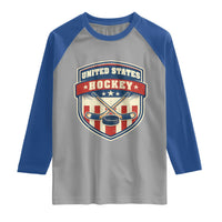 Hockey Crossed Sticks And Puck Retro USA Shield Flag Raglan Shirt Red White Blue Striped Patriotic Sports Fan Pride Graphic