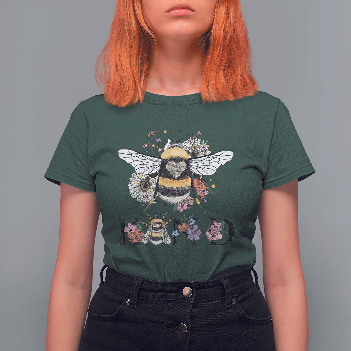 Women's dark green crewneck t-shirt with bee-and-floral retro graphic and BE KIND print