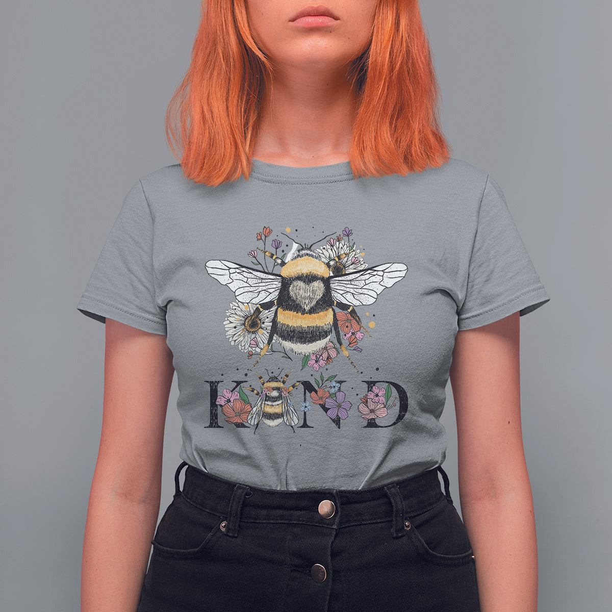 Women's gray crewneck t-shirt with bee-and-floral retro graphic and BE KIND print