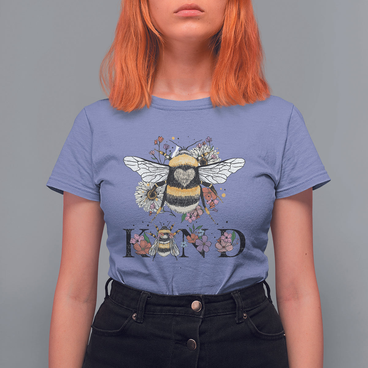 Women's light blue crewneck t-shirt with bee-and-floral retro graphic and BE KIND print