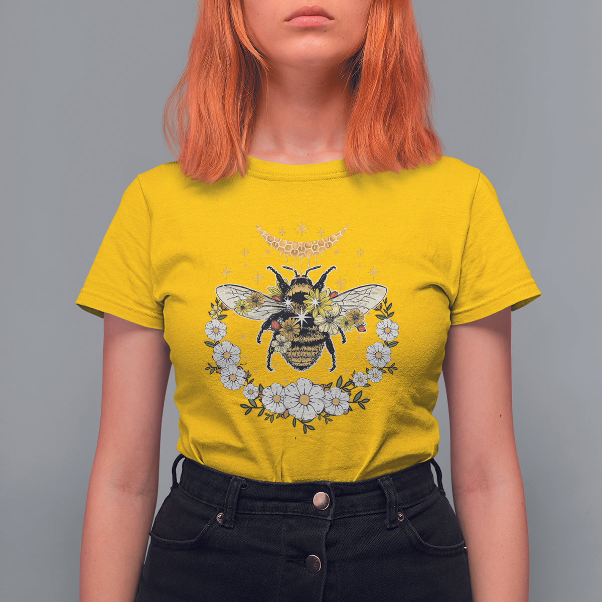 Yellow crew-neck women’s t-shirt with bee, crescent moon, and floral wreath graphic