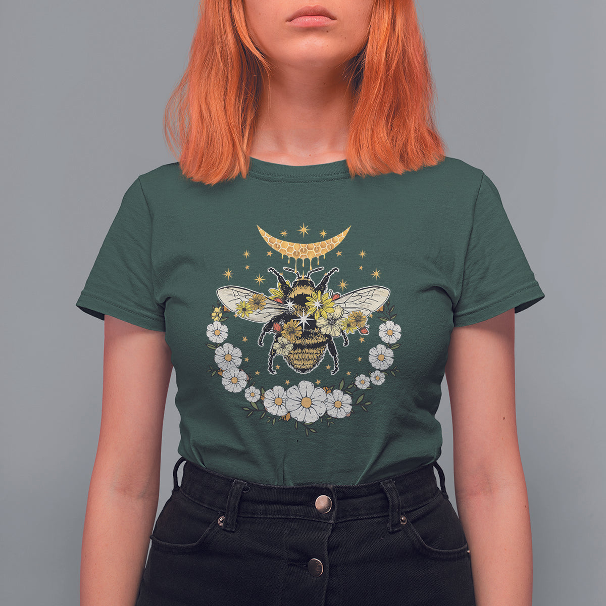 Dark green crew-neck women’s t-shirt with bee, crescent moon, and floral wreath graphic