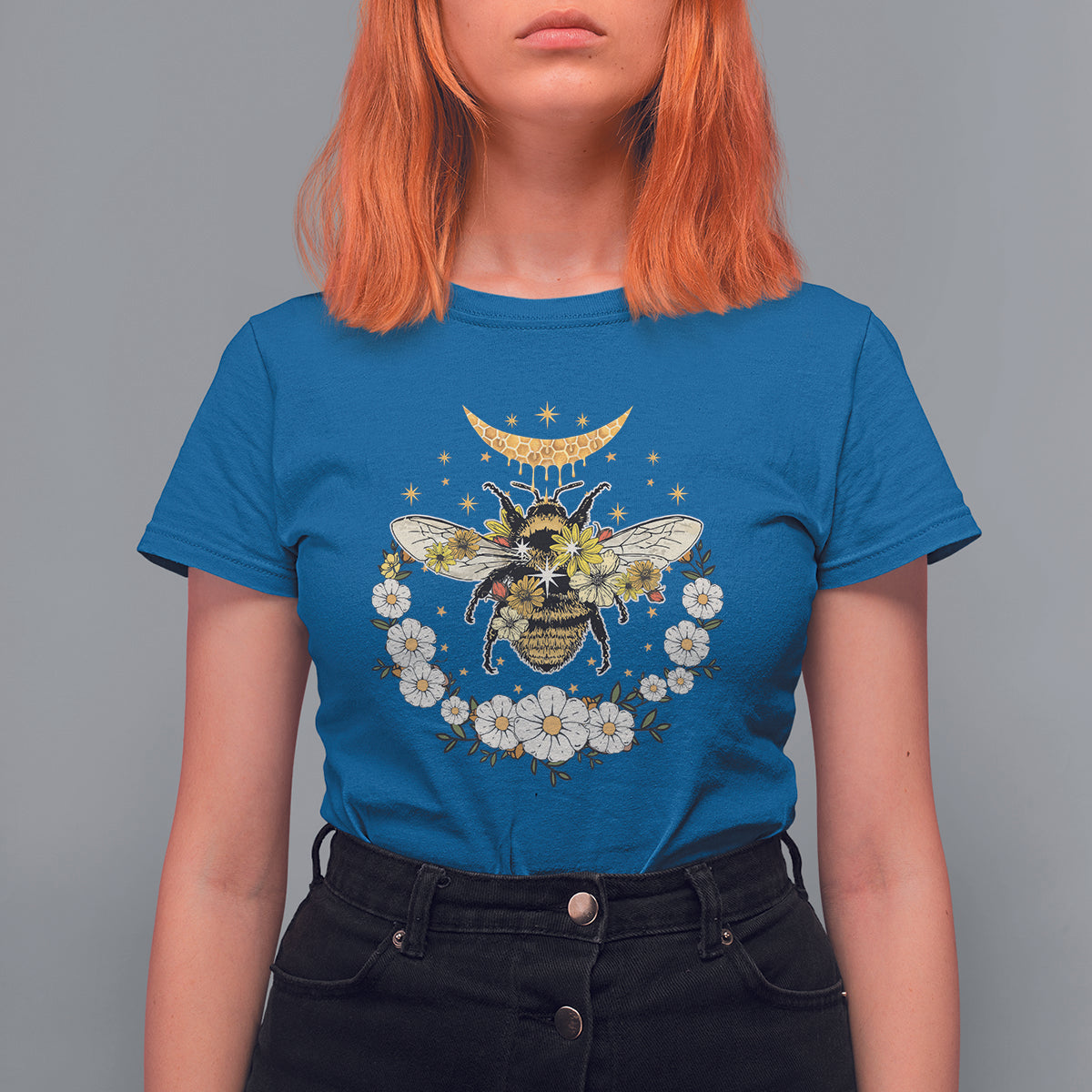 Bright blue crew-neck women’s t-shirt with bee, crescent moon, and floral wreath graphic