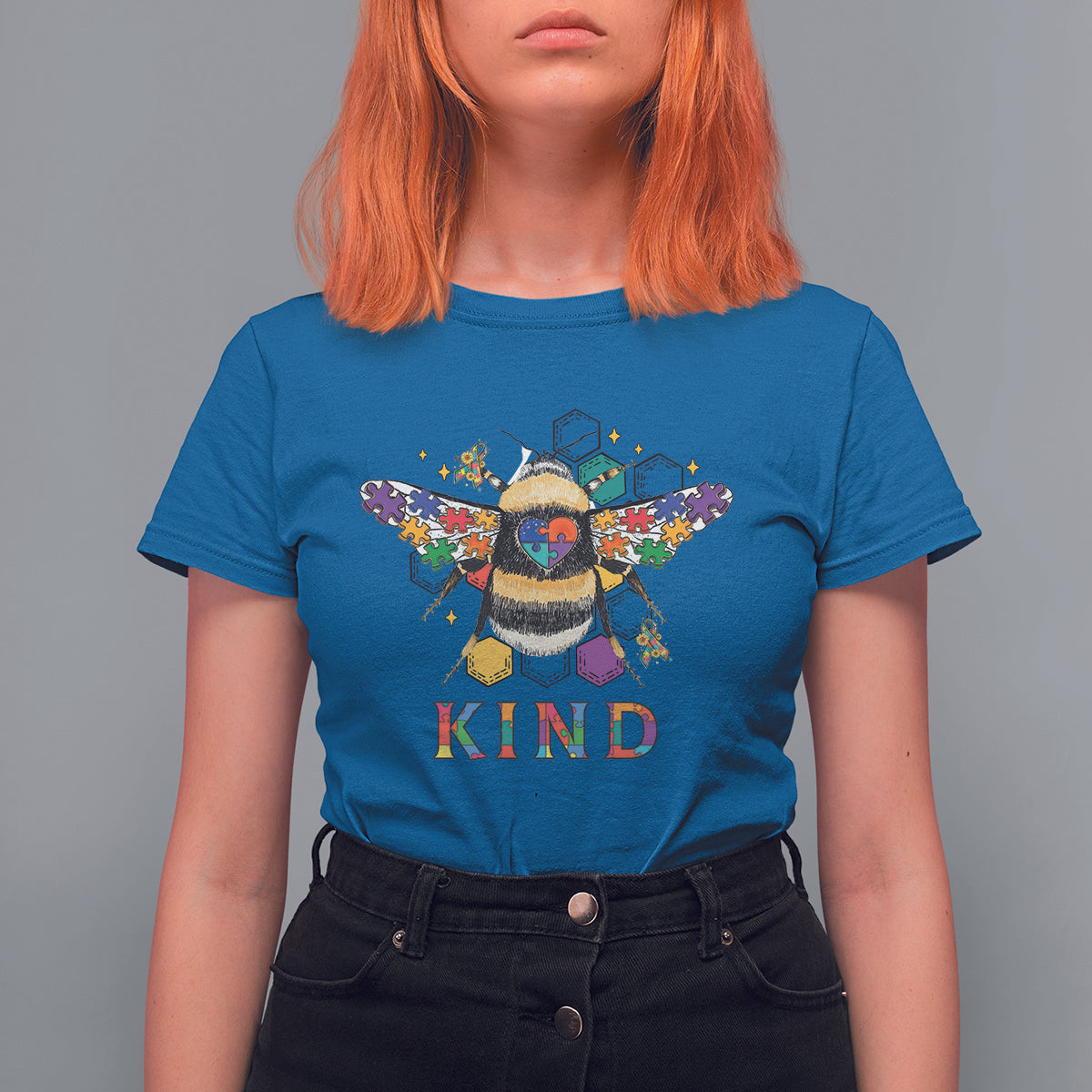 Royal blue bee graphic T-shirt with KIND text and a colorful winged bee character.