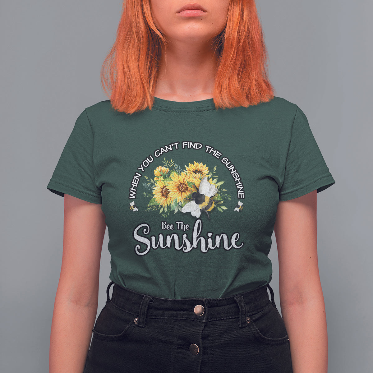 Dark forest green women’s T-shirt with sunflower and bee graphic, “Bee The Sunshine”