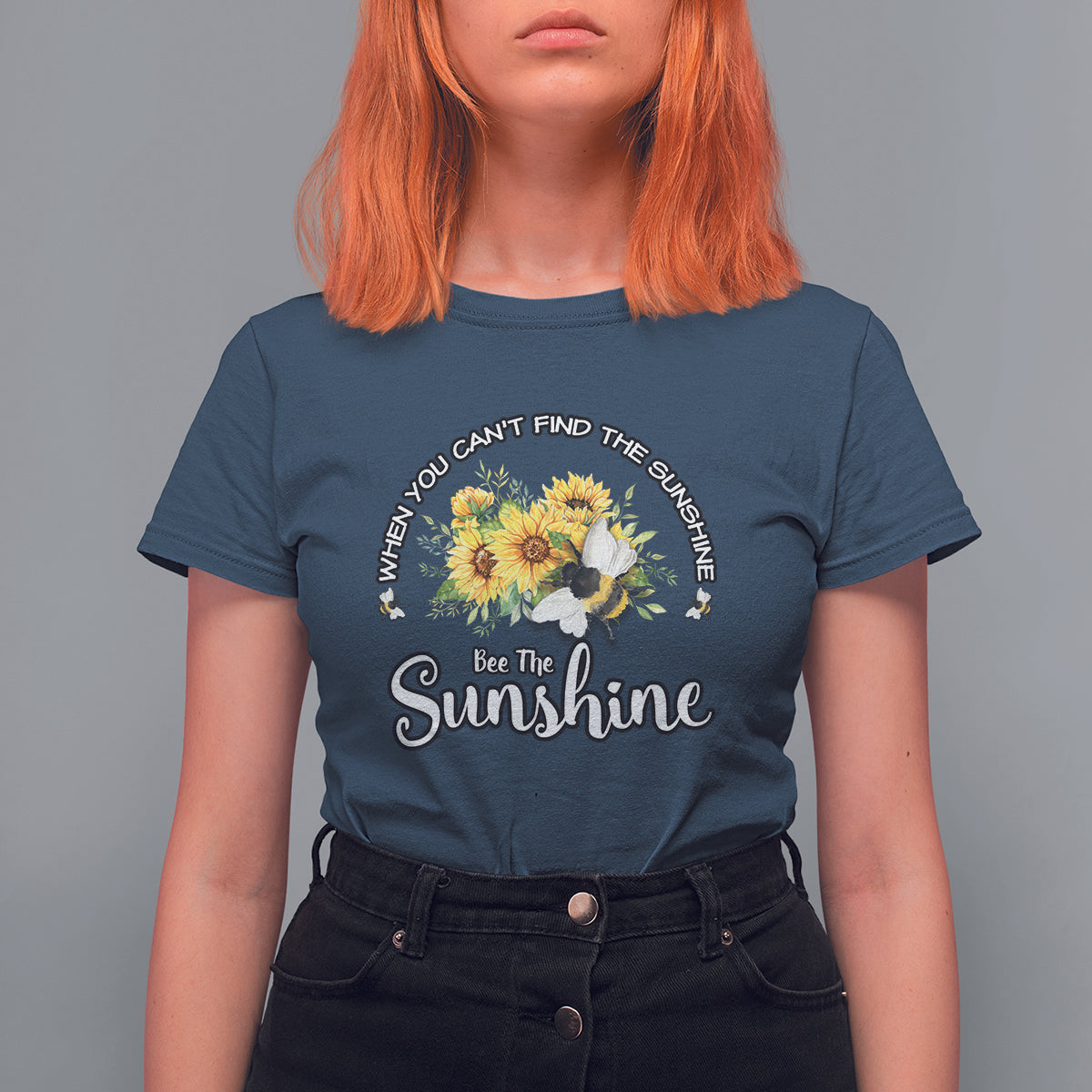 Navy women’s T-shirt with sunflower and bee graphic, “Bee The Sunshine” slogan