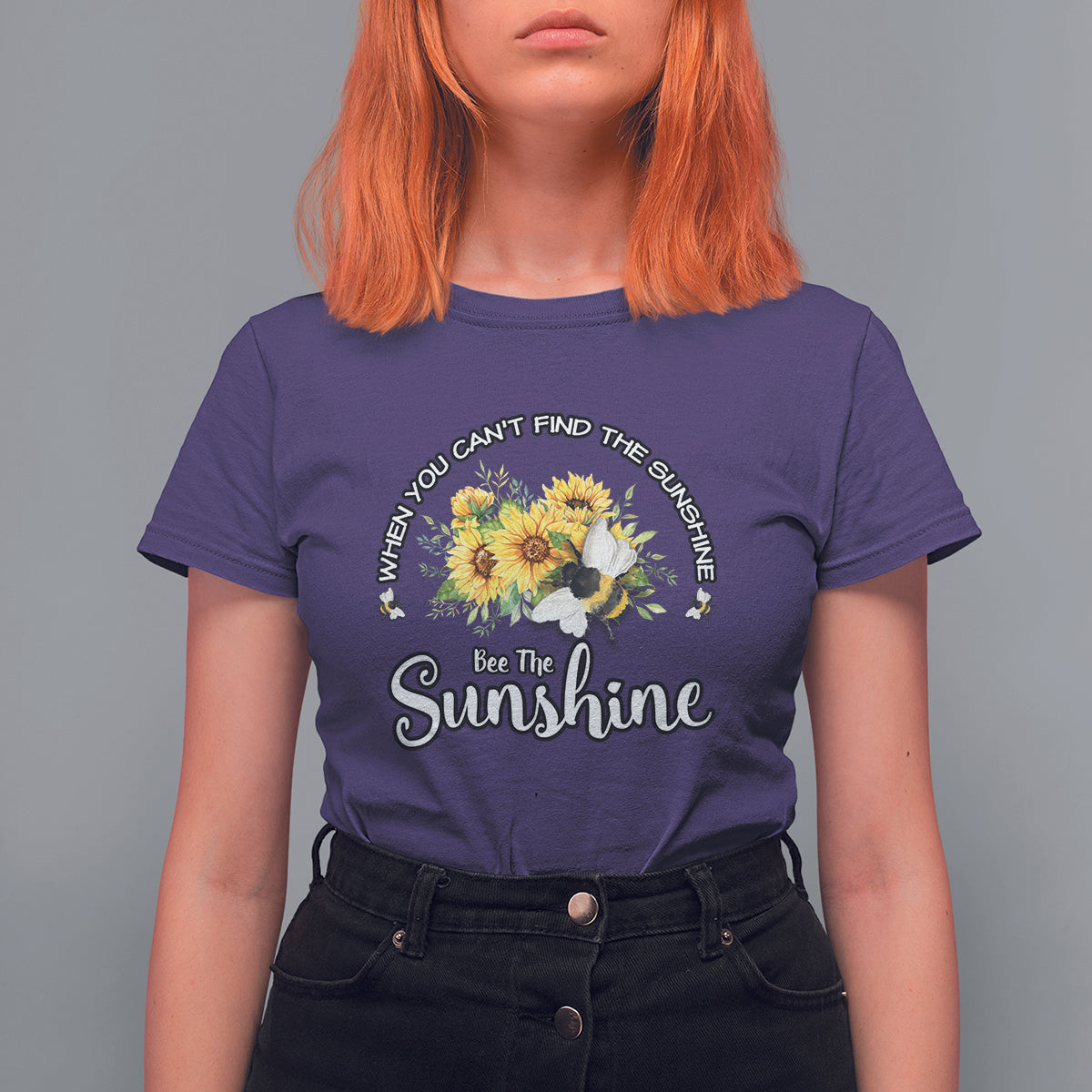 Purple women’s T-shirt with sunflower and bee graphic, “Bee The Sunshine” slogan