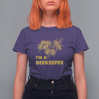 Purple Beekeeper T-shirt with bee hive graphic and “I’M A BEEKEEPER” lettering