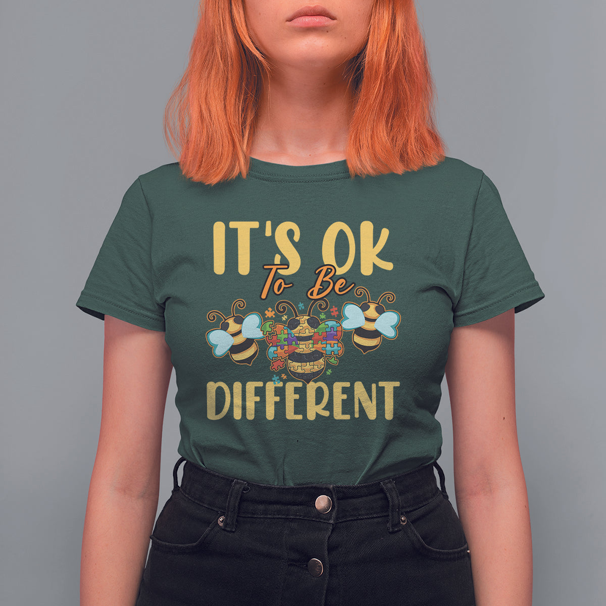 Women's bee graphic T-shirt, dark green with colorful 'It's ok to be different' front print