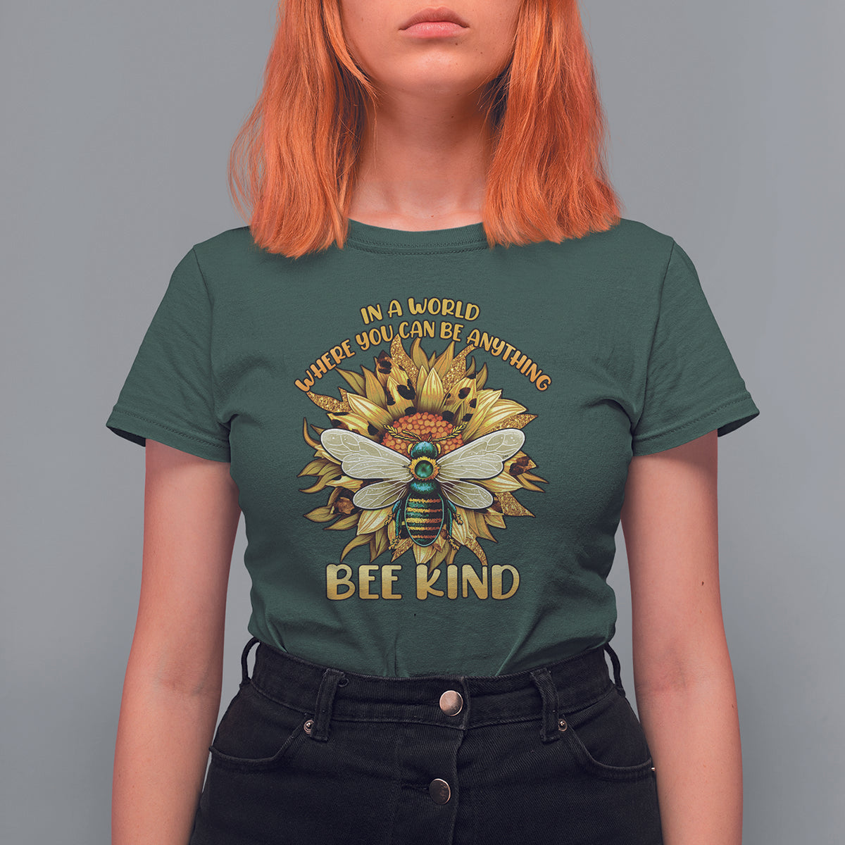 Dark forest green "Bee Kind" T-shirt with large floral bee graphic on chest