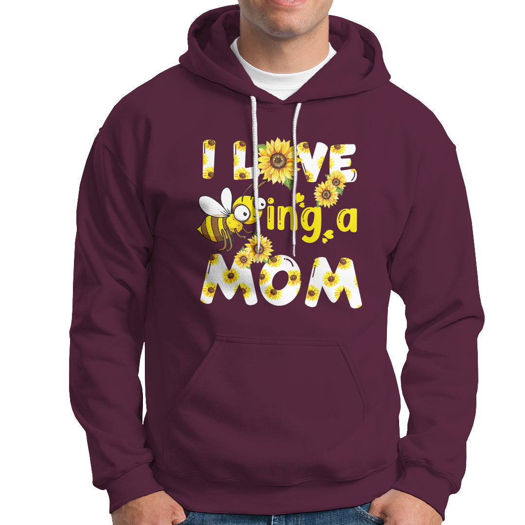 Maroon sunflower bee mom hoodie with floral bee graphic and text, front kangaroo pocket