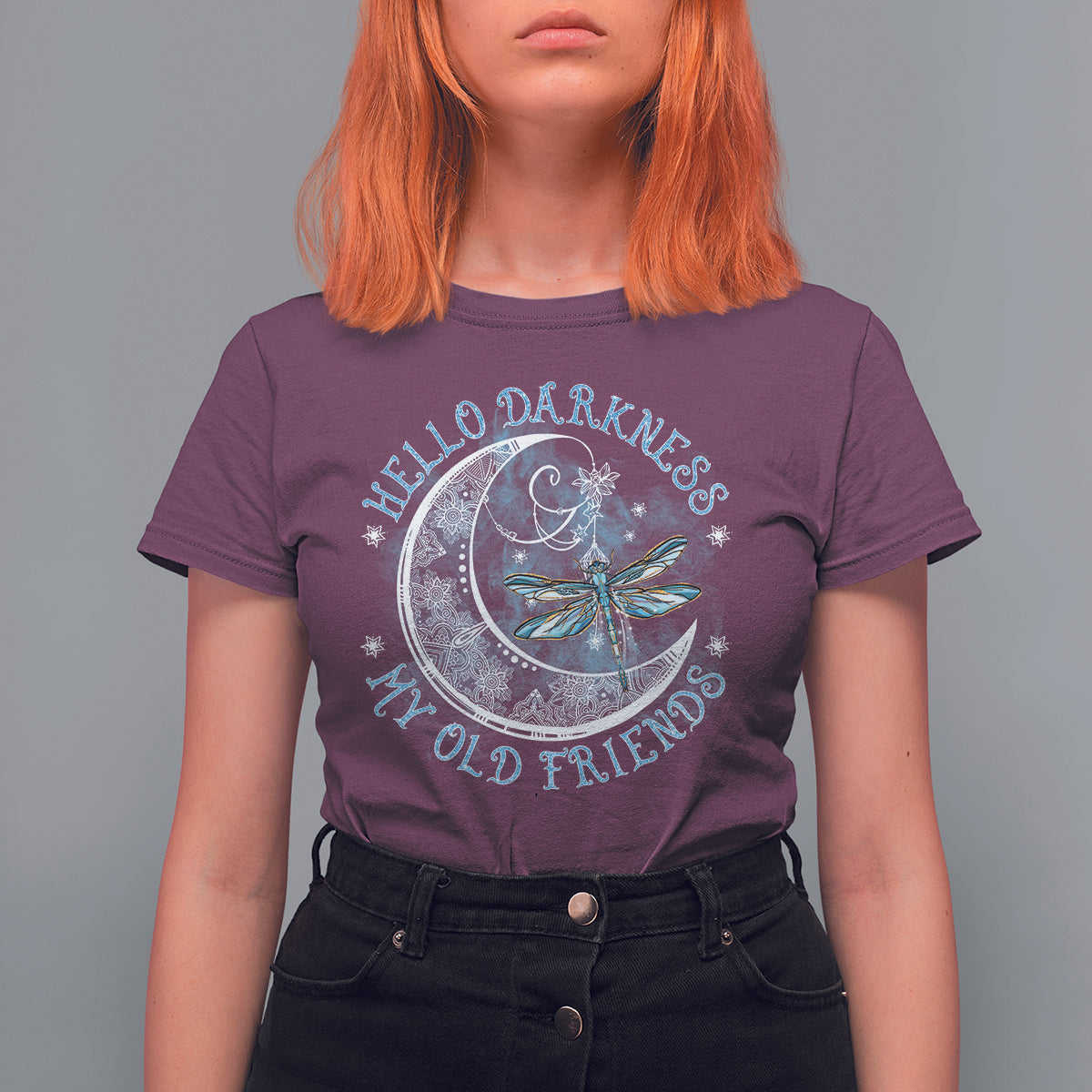 Women’s purple graphic T-shirt with moon and dragonfly emblem on the front