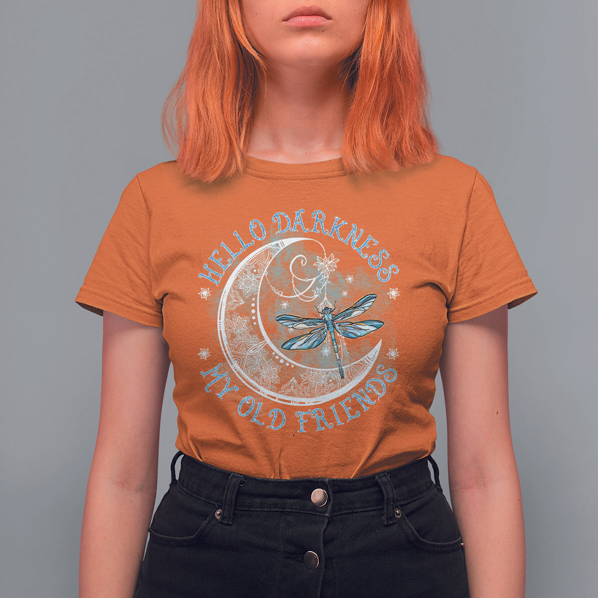 Women’s orange graphic T-shirt featuring moon and dragonfly emblem front print