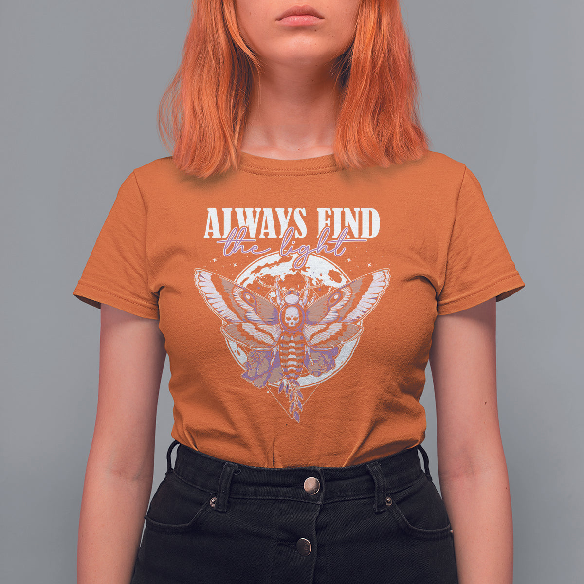 Women’s orange T-shirt with moth graphic and “Always Find the Light” text on chest
