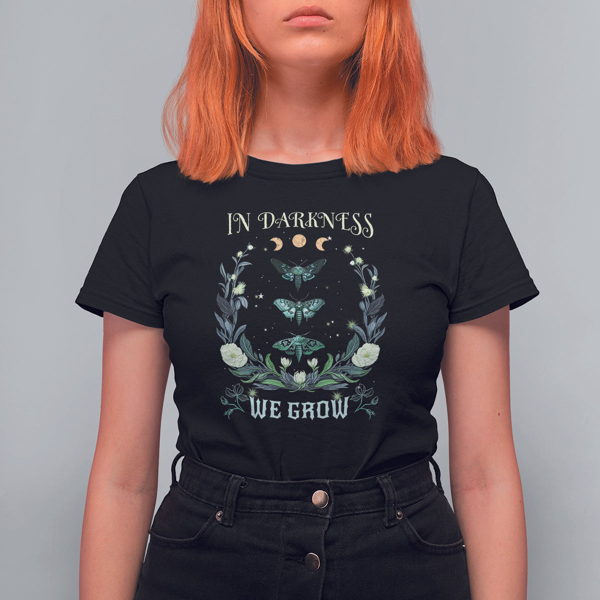 Women’s black t-shirt with teal moth and floral wreath graphic, crew neck