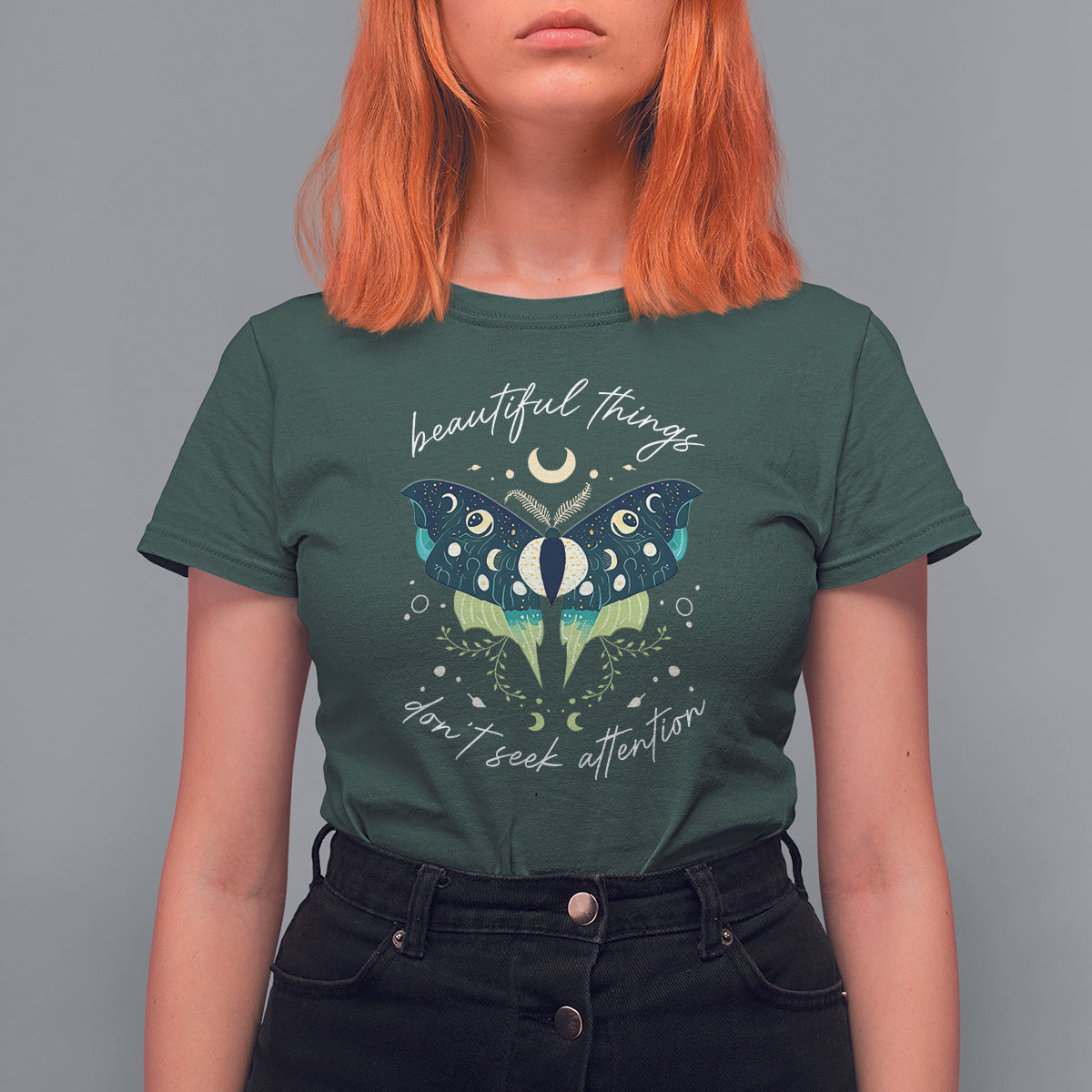 Women’s dark green T-shirt with teal moth illustration and crescent moons, “beautiful things”