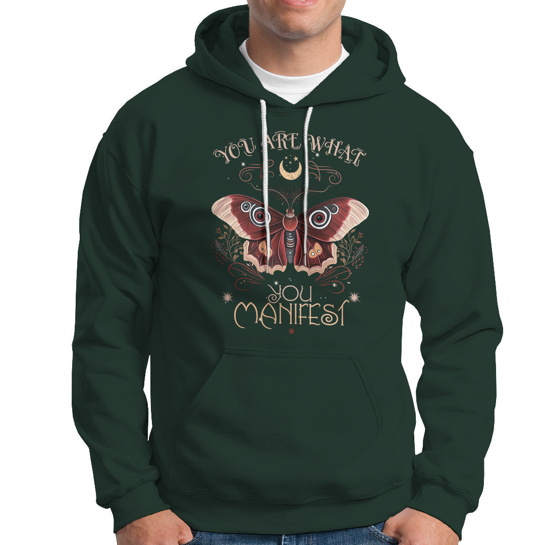 Dark forest green hoodie with front moth graphic and "You Are What You Manifest" text