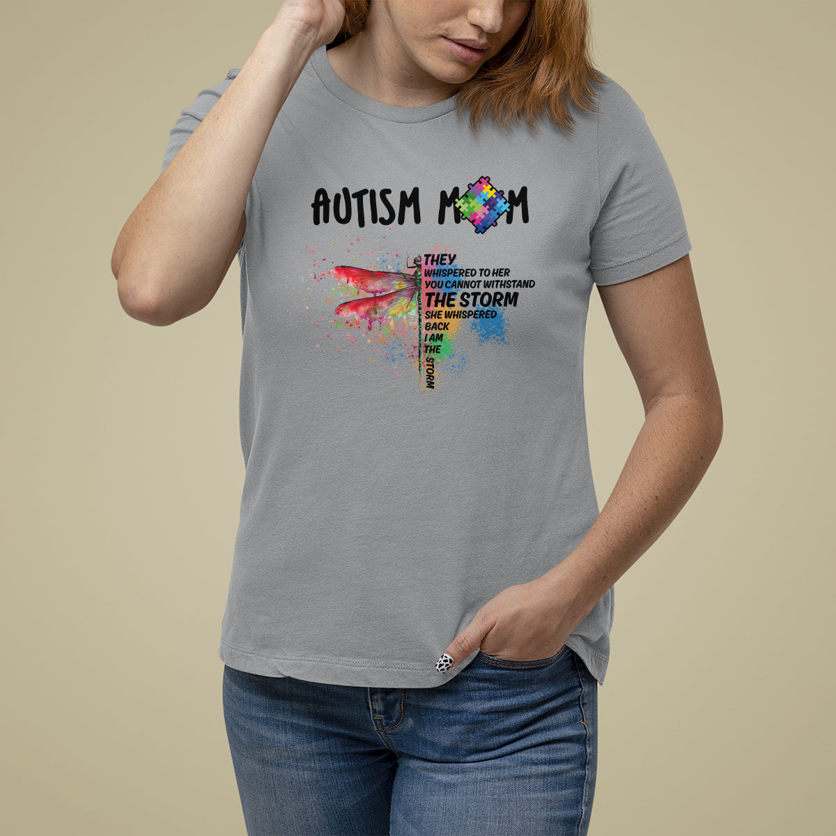 Women's autism awareness graphic T-shirt, sport gray, rainbow puzzle dragonfly "storm" text
