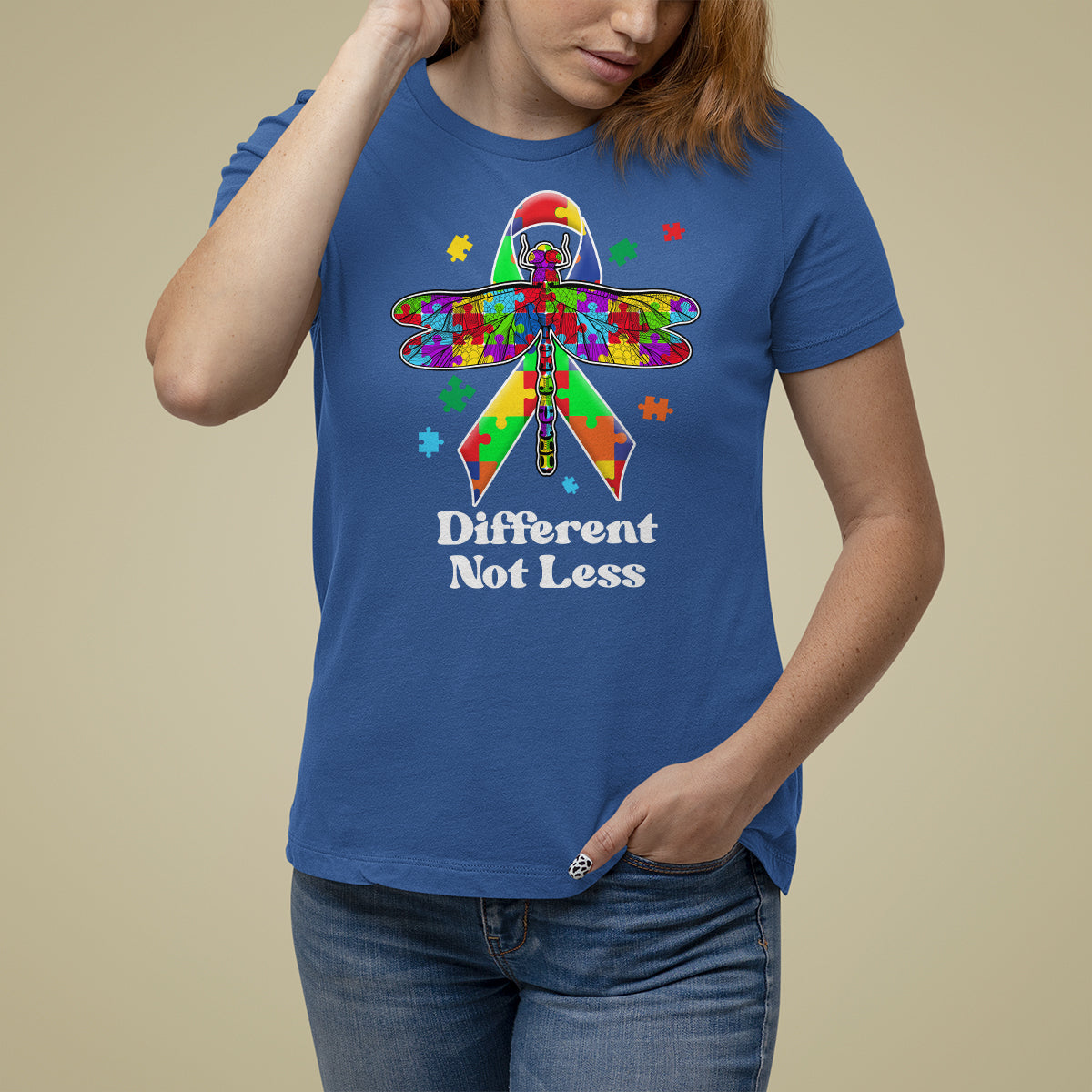 Royal blue autism awareness T-shirt with colorful puzzle dragonfly graphic and “Different Not Less”