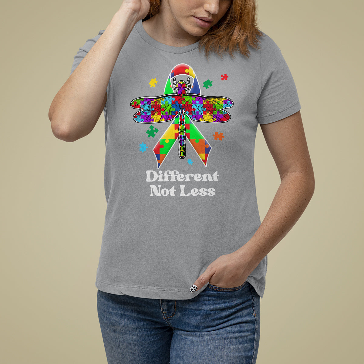 Sport gray autism awareness T-shirt with colorful puzzle dragonfly graphic and “Different Not Less”