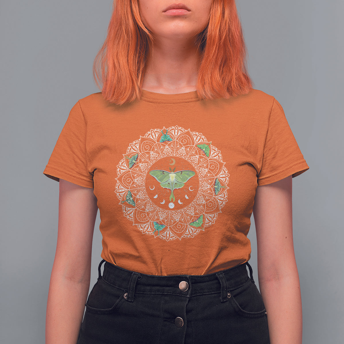 Orange women’s T-shirt with circular luna moth mandala insect graphic