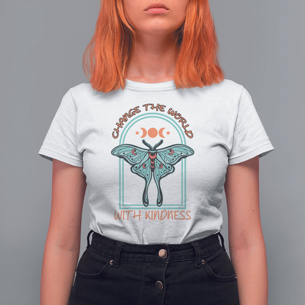 White women’s t-shirt with teal luna moth graphic and “with kindness” slogan
