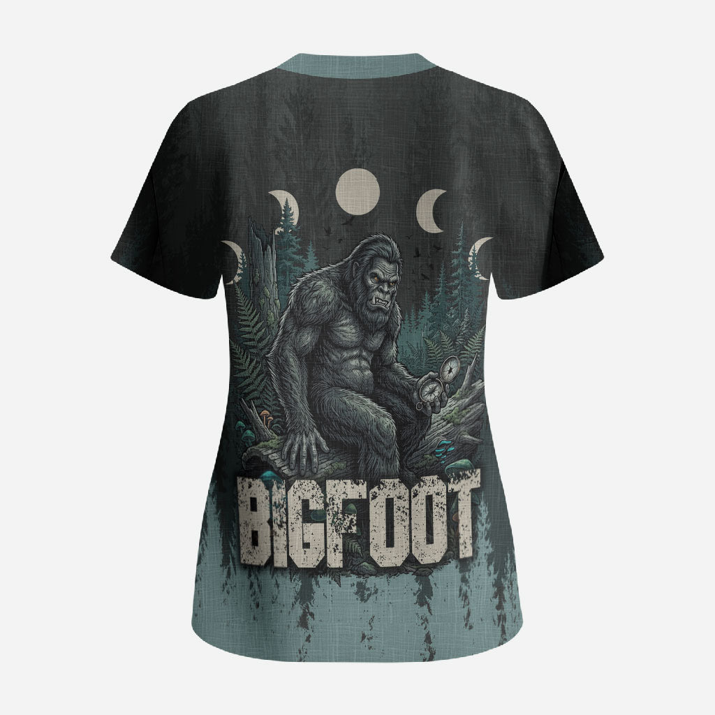 Bigfoot Wilderness Solitude Scrub Top Cryptid Forest Graphic In Distressed Vintage Style