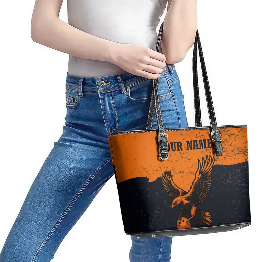 Flying Eagle Carrying Bowling Ball Leather Tote Bag with Grunge Orange and Black Splatter Design - Wonder Print Shop