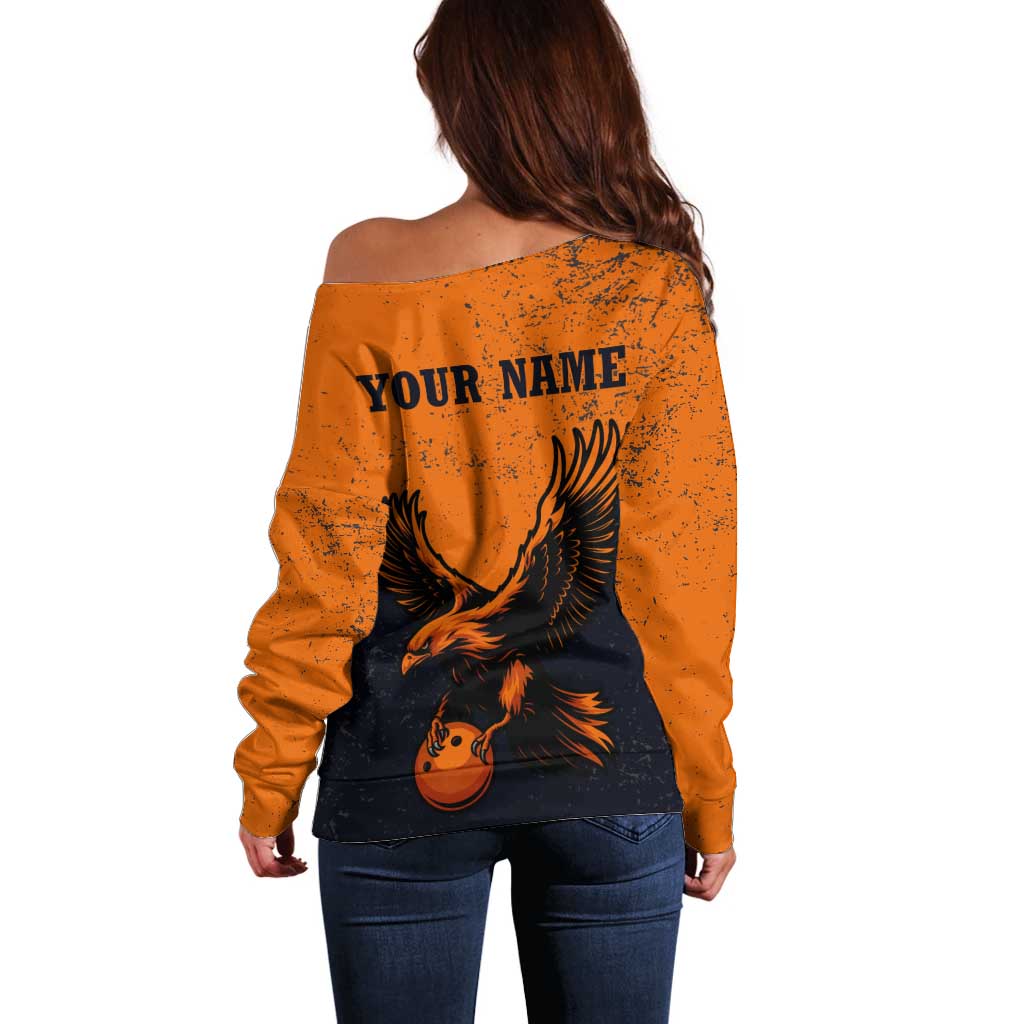 Flying Eagle Carrying Bowling Ball Off Shoulder Sweater with Grunge Orange and Black Splatter Design - Wonder Print Shop