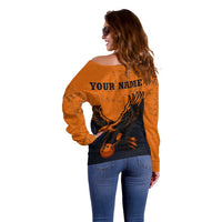 Flying Eagle Carrying Bowling Ball Off Shoulder Sweater with Grunge Orange and Black Splatter Design - Wonder Print Shop