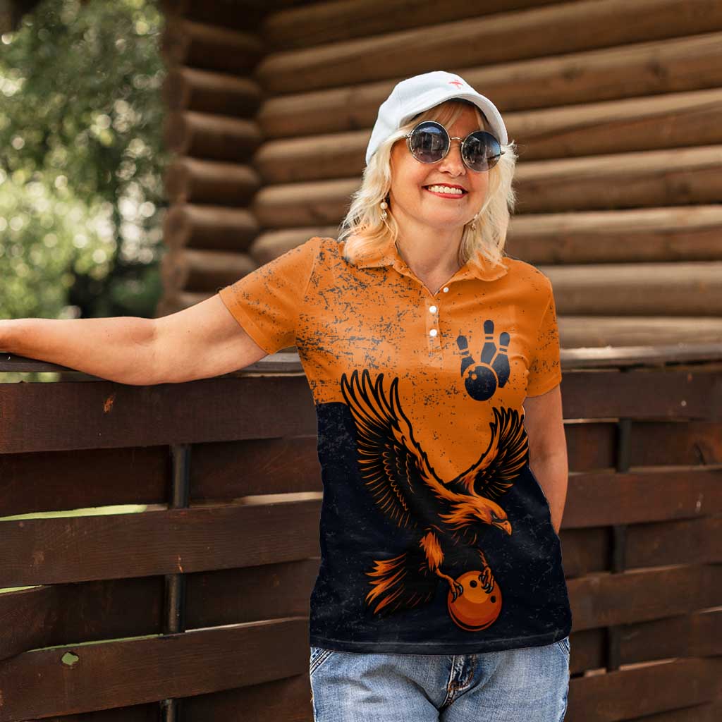 Flying Eagle Carrying Bowling Ball Women Polo Shirt with Grunge Orange and Black Splatter Design - Wonder Print Shop