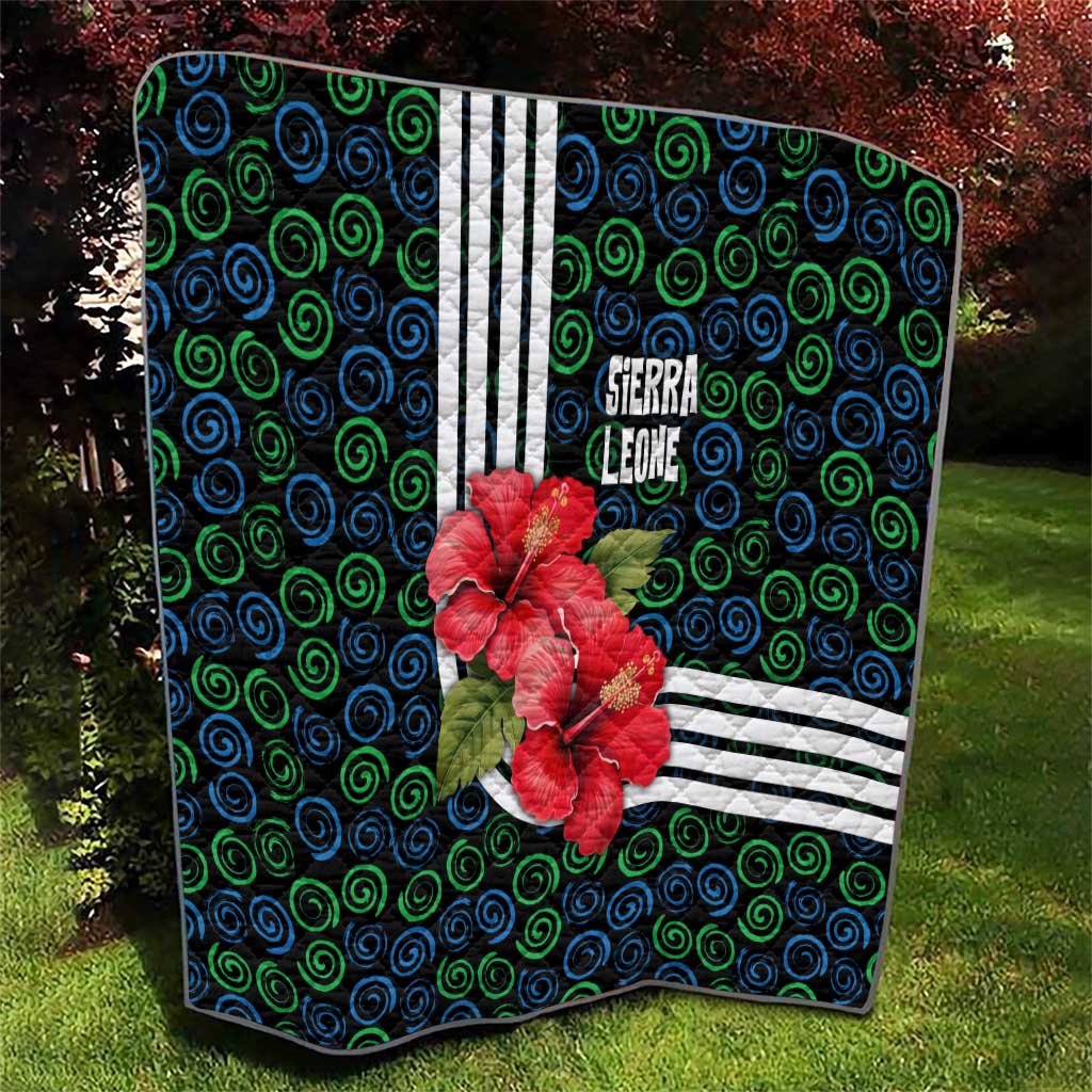 Sierra Leone Quilt with Red Hibiscus Floral Design and Tribal Swirl Pattern