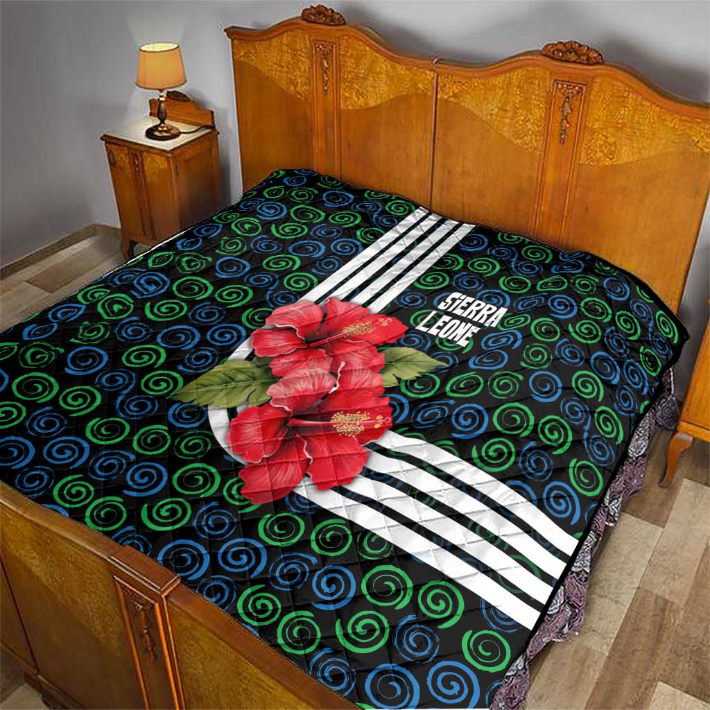 Sierra Leone Quilt with Red Hibiscus Floral Design and Tribal Swirl Pattern