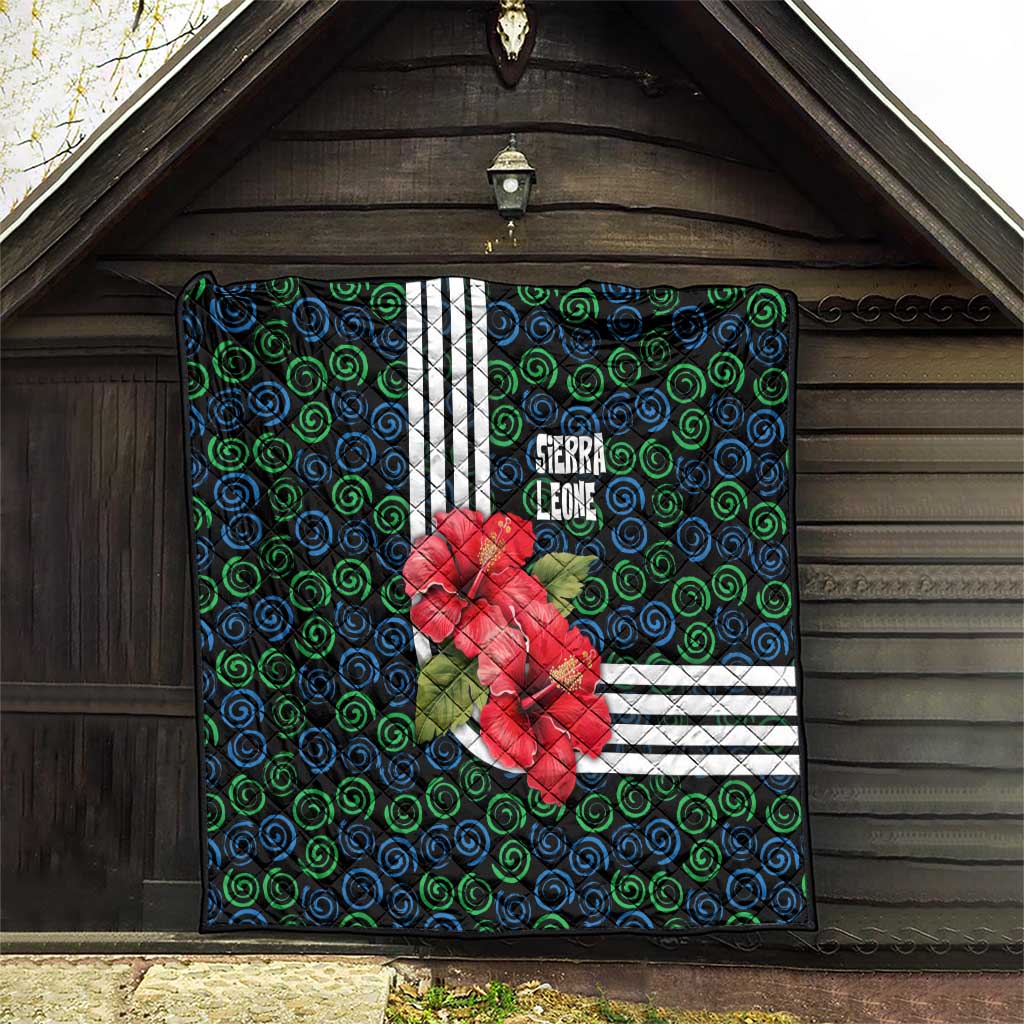 Sierra Leone Quilt with Red Hibiscus Floral Design and Tribal Swirl Pattern