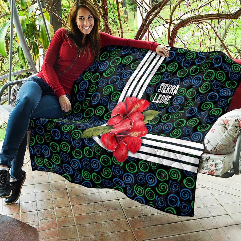 Sierra Leone Quilt with Red Hibiscus Floral Design and Tribal Swirl Pattern