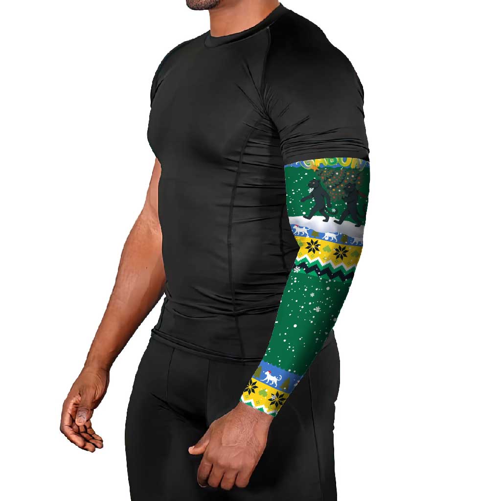 Gabon Christmas Arm Sleeves with Black Panthers Carrying Tree and Green Yellow Snowflake Pattern - Wonder Print Shop