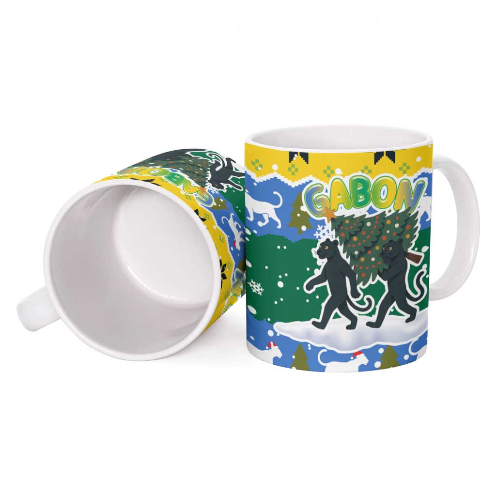 Gabon Christmas Ceramic Mug with Black Panthers Carrying Tree and Green Yellow Snowflake Pattern - Wonder Print Shop