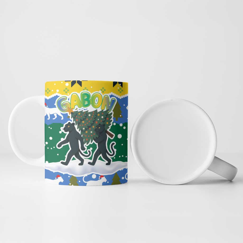 Gabon Christmas Ceramic Mug with Black Panthers Carrying Tree and Green Yellow Snowflake Pattern - Wonder Print Shop