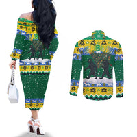 Gabon Christmas Couples Matching Off The Shoulder Long Sleeve Dress and Long Sleeve Button Shirt with Black Panthers Carrying Tree and Green Yellow Snowflake Pattern - Wonder Print Shop