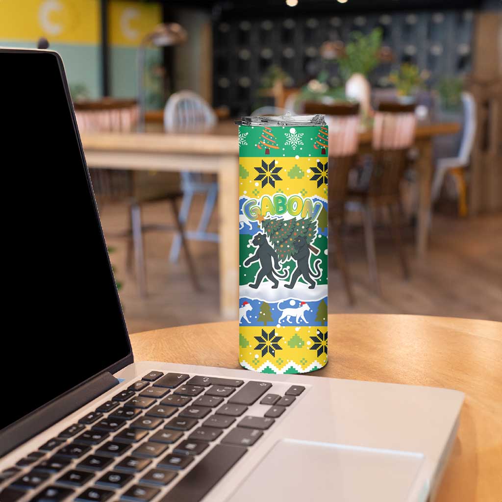 Gabon Christmas Skinny Tumbler with Black Panthers Carrying Tree and Green Yellow Snowflake Pattern - Wonder Print Shop